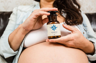 Expecting mother showing Vitamin B12 supplement for prenatal care